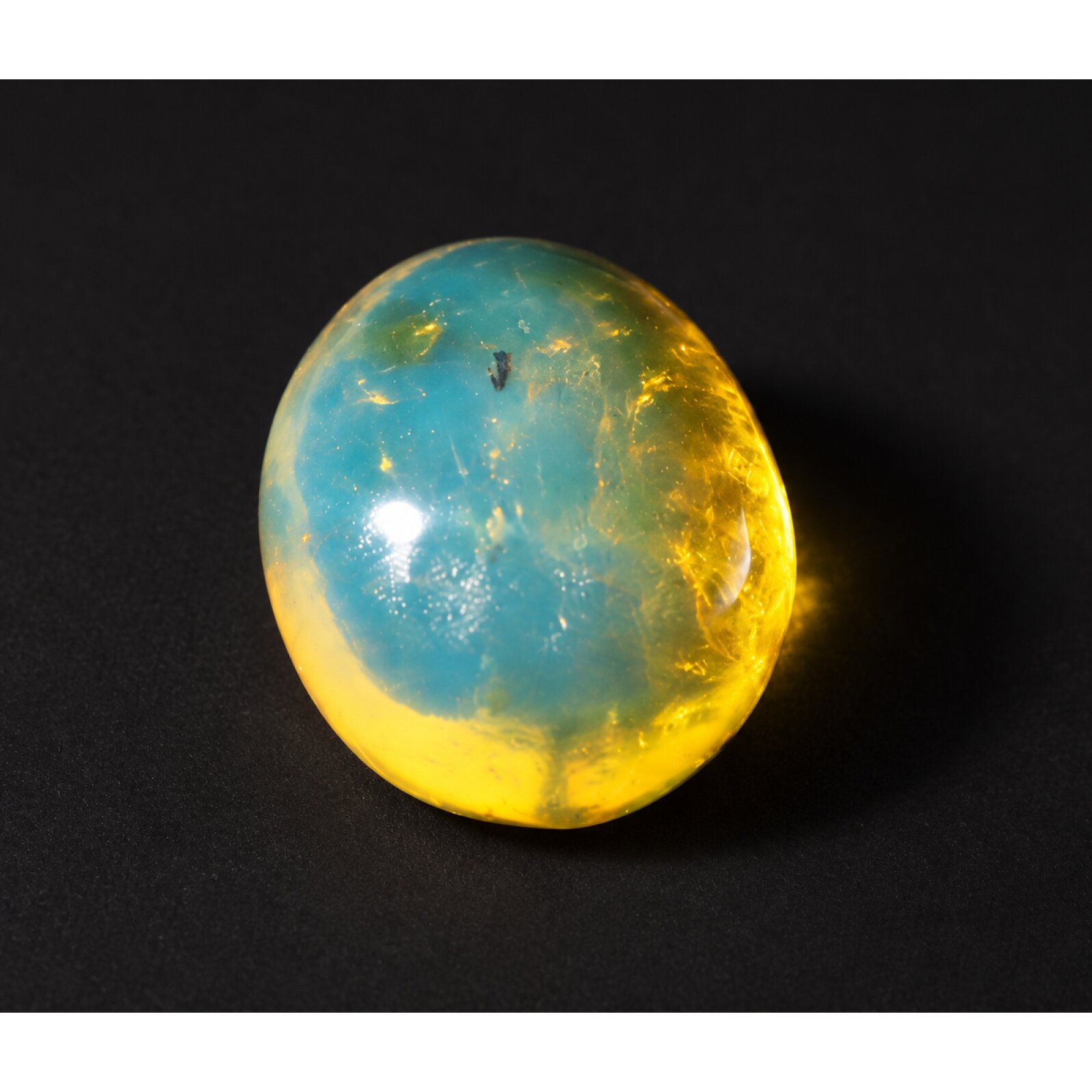 Nature created deep blue Dominican amber cabochon