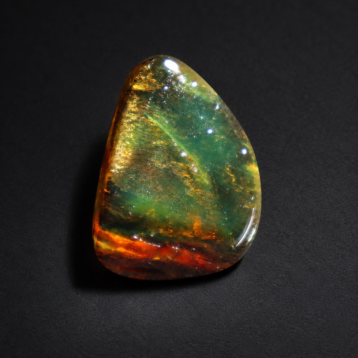 Genuine orange green polished Dominican amber 26mm